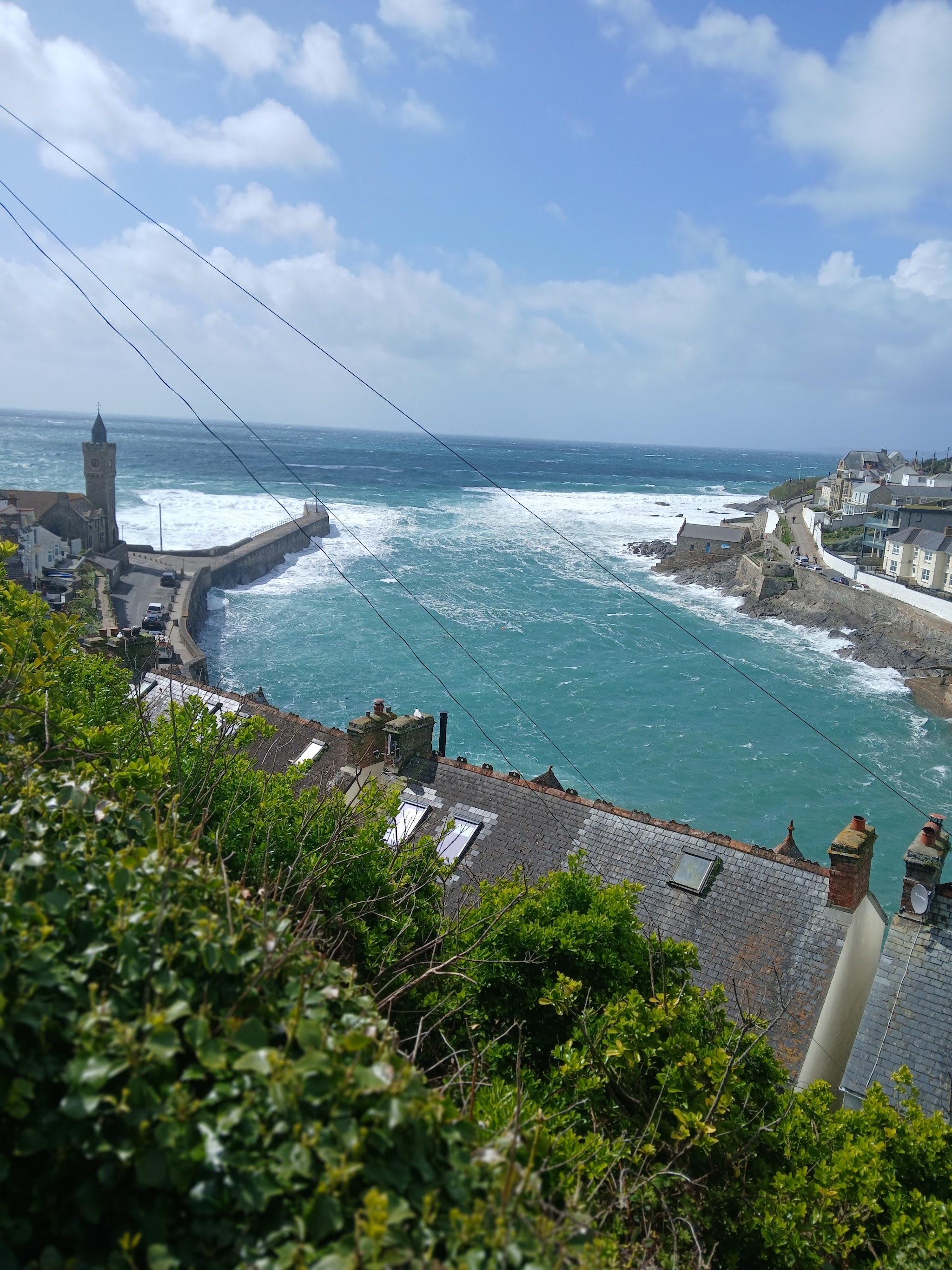 Porthleven harbour and clock tower seen from the hill above the town
